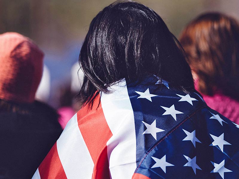 Person Carrying American Flag over their Back 1 Person Carrying American Flag over their Back 1